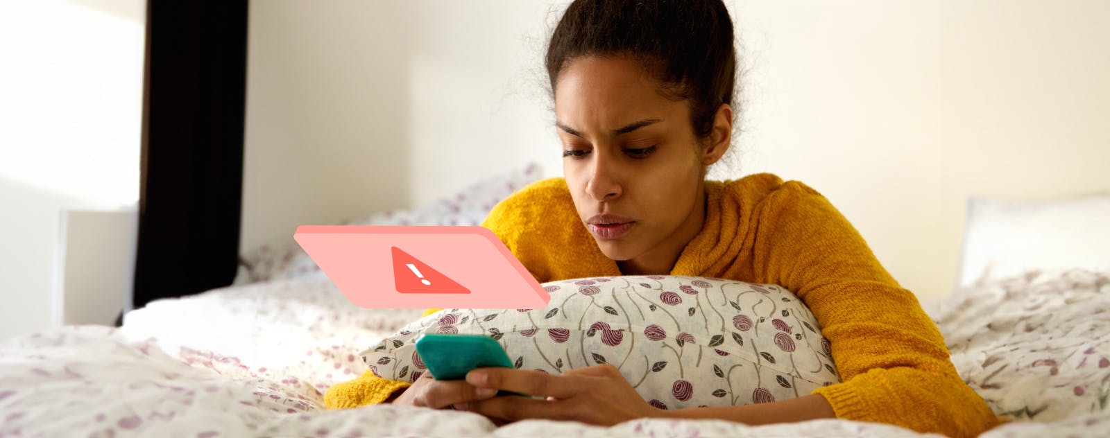 A women on the bed receiving a potential scam call.